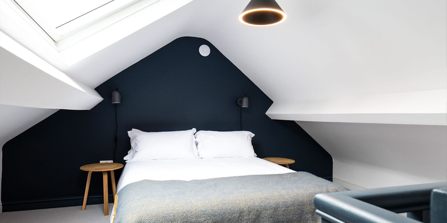 bed, attic room, white ceiling, blue walls, bedside tables, window, natural light
