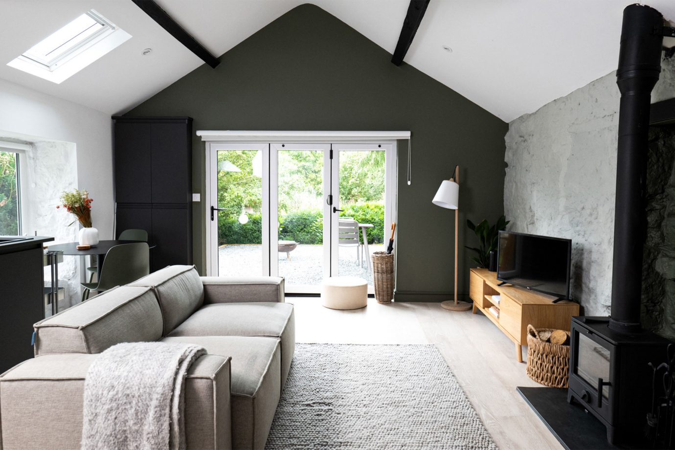 Living room, sofa, lamp, carpet, television, window, natural light